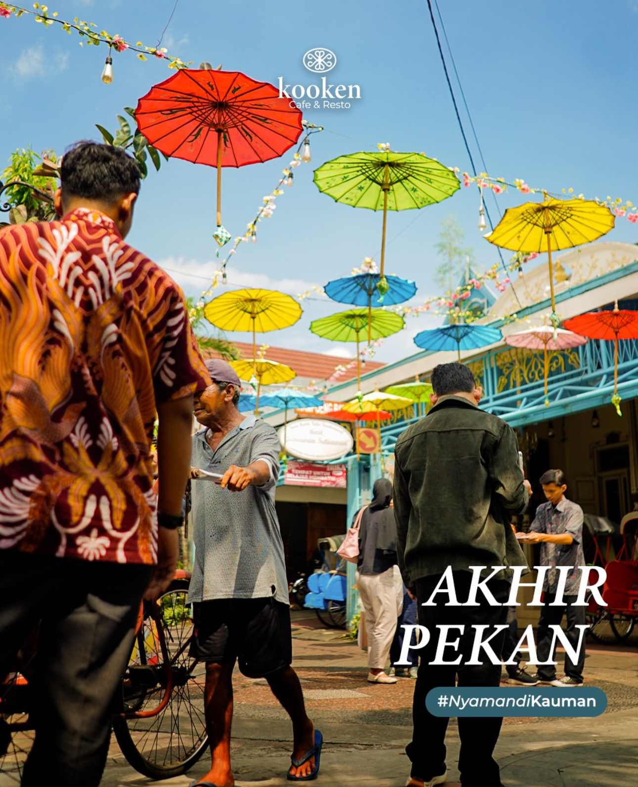 Colourful umbrellas above the Kauman heritage lane